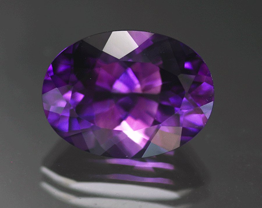 Violetish purple amethyst, 8.55 cts, 16 x 12 mm, oval brilliant, Jackson’s Crossroads, Wilkes Co., Georgia. © The Gem Trader.