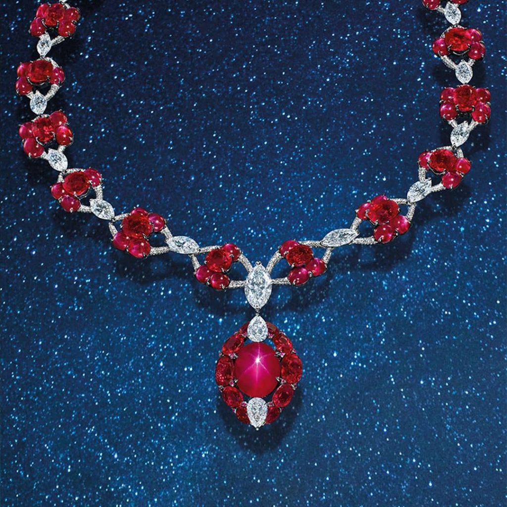 a 19.53 carat unheated Burmese star ruby necklace with numerous star and faceted Burmese rubies (45.69 carats total), the majority of which classify as "pigeon's blood” red in the trade as well as numerous D and E color diamonds.